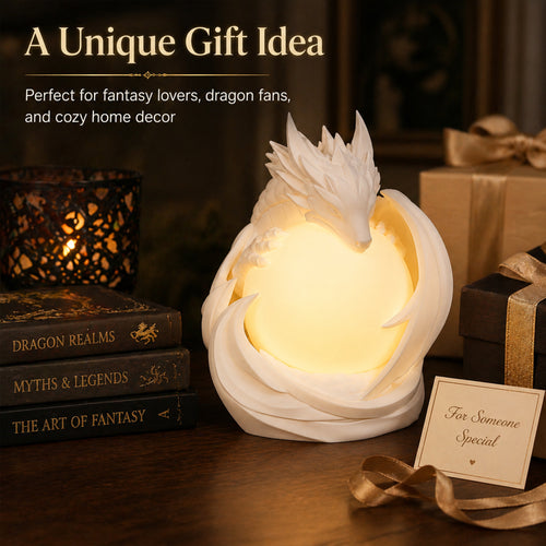 3D printed dragon table lamp with a matte white dragon curled around a warm glowing orb