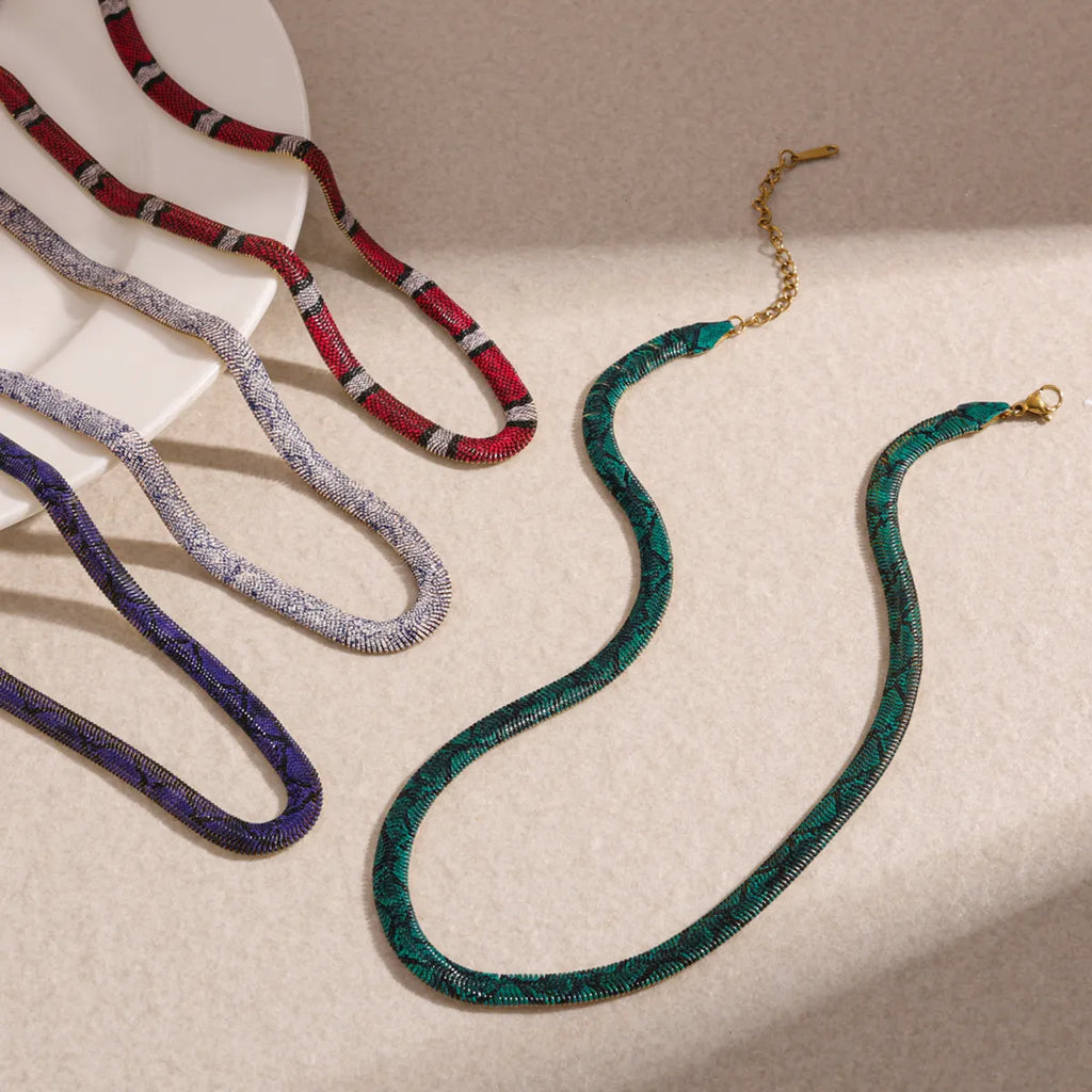 Coral Red, Porcelain White, Midnight Blue and Emerald Green necklaces