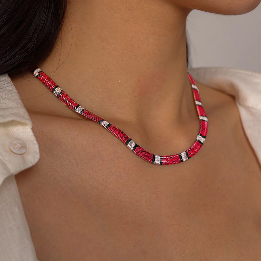 Coral Red serpent necklace, worn